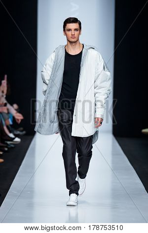 MOSCOW RUSSIA - MARCH 15 2017: Model walk runway for DESIGNER NIKOLAY LEGENDA catwalk at Fall-Winter 2017-2018 at Mercedes-Benz Fashion Week Russia. Men's fashion.