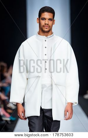 MOSCOW RUSSIA - MARCH 15 2017: Model walk runway for DESIGNER NIKOLAY LEGENDA catwalk at Fall-Winter 2017-2018 at Mercedes-Benz Fashion Week Russia. Men's fashion.