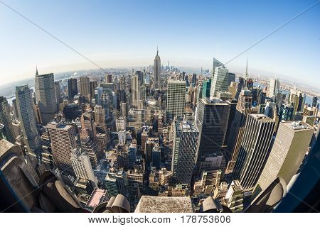 New York City, United States of America - March 24: Manhattan downtown skyline with Empire State Building and skyscrapers seen from Top of the Rock observation deck on March 24, 2015.