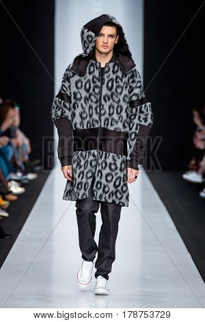 MOSCOW RUSSIA - MARCH 15 2017: Model walk runway for DESIGNER NIKOLAY LEGENDA catwalk at Fall-Winter 2017-2018 at Mercedes-Benz Fashion Week Russia. Men's fashion.