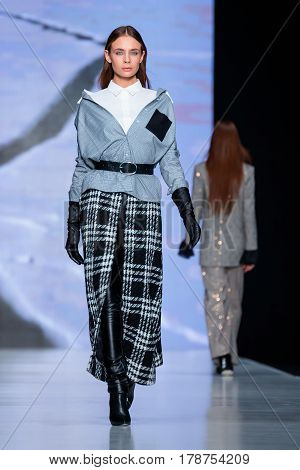 MOSCOW RUSSIA - MARCH 15 2017: Model walk runway for OFERA catwalk (designer OKSANA FEDOROVA) at Fall-Winter 2017-2018 at Mercedes-Benz Fashion Week Russia.