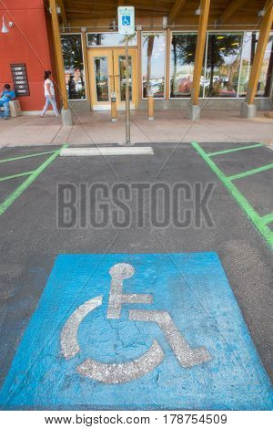 old Handicapped parking spot - transportation infrastructure road markings. infront shop