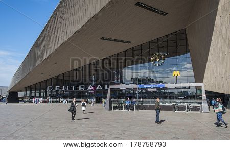 Rotterdam The Netherlands - March 10 2017: Modern railway station by architect MVSA in Rotterdam with square and travelers in the Netherlands.