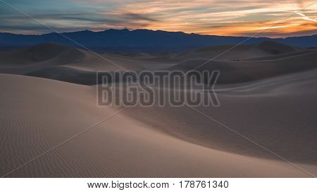 Waves Of Sand On Top Of The Dunes. Sunrise. Desert In Mesquite Flat, Death Valley, Usa.