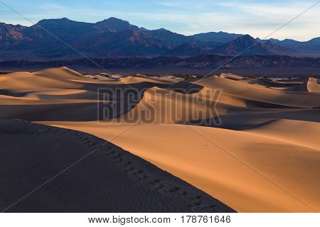Waves Of Sand On Top Of The Dunes. Sunrise. Desert In Mesquite Flat, Death Valley, Usa.