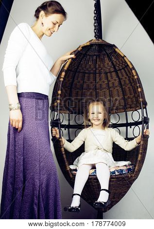 young mother with daughter at luxury home interior vintage, old fashion relashionship family