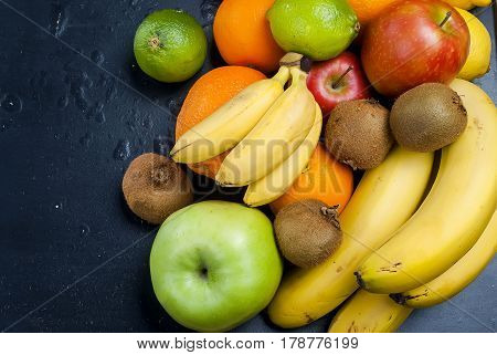 Many Various Fruits On A Black Background