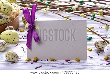 Easter Background With Yellow Easter Eggs Pussy Willow Branches Purple Ribbon And Space For Text.