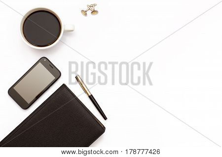 Black, Diary, Pen, Cufflinks, Cup Of Black Coffee And Phone On White Background. Desk In The Office.