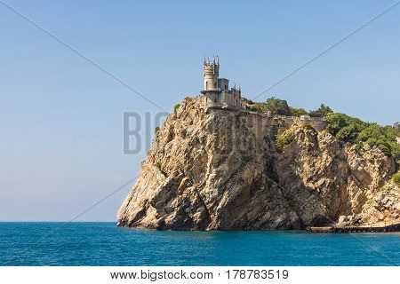 View from the sea on a 40-meter Avrorinoj the rock of Cape AI-Todor with the architectural monument "swallow's nest". Gaspra South coast of Crimea