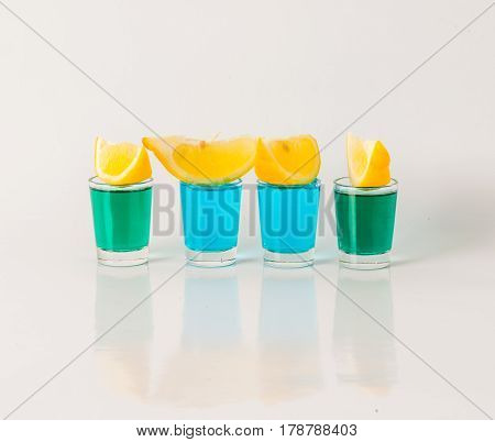 Glasses With Blue And Green Kamikaze, Glamorous Drink, Mixed Drink Poured Into Shot Glasses