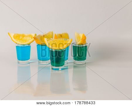Glasses With Blue And Green Kamikaze, Glamorous Drink, Mixed Drink Poured Into Shot Glasses