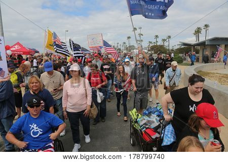 Huntington Beach, CA - March 25 2017: Make America Great Again March. Thousands of Supporters of republican president Donald Trump, wave flags, signs and march at a MAGA March in Huntington Beach. 
