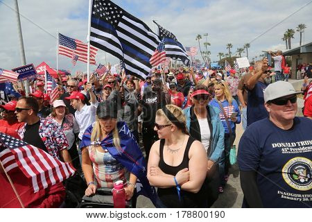 Huntington Beach, CA - March 25 2017: Make America Great Again March. Thousand of Supporters of republican president Donald Trump, march and wave flags, at a MAGA March in Huntington Beach. 



