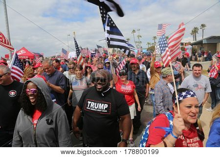 Huntington Beach, CA - March 25 2017: Make America Great Again March. Thousand of Supporters of republican president Donald Trump, march and wave flags, at a MAGA March in Huntington Beach. 



