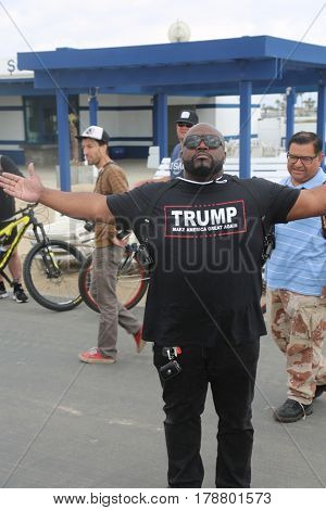 Huntington Beach, CA - March 25 2017: Make America Great Again March. Thousand of Supporters of republican president Donald Trump, wear T-Shirts march and wave flags, at a MAGA March. 




