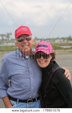 Huntington Beach, CA - March 25 2017: Make America Great Again March. Thousand of Supporters of republican president Donald Trump, wear T-Shirts march and wave flags, at a MAGA March. 




