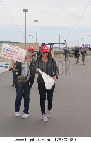 Huntington Beach, CA - March 25 2017: Make America Great Again March. Thousand of Supporters of republican president Donald Trump, wear T-Shirts march and wave flags, at a MAGA March. 




