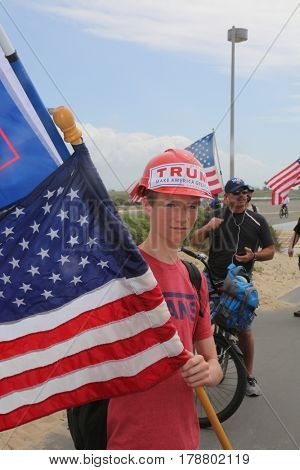 Huntington Beach, CA - March 25 2017: Make America Great Again March. Thousand of Supporters of republican president Donald Trump, march and wave flags, at a MAGA March in Huntington Beach. 




