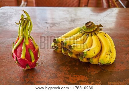 Pitaya And Bananas On A Table