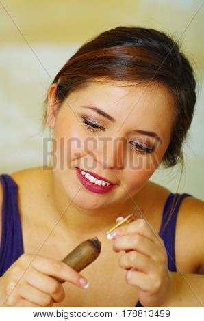 Beautiful young woman wood burning with pyrography pen
