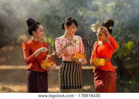 Laos girls splashing water durin tradition festival Songkran festival