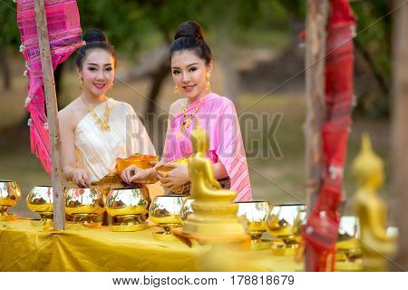 Asian woman like to make merit in thailand