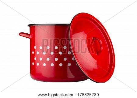 front view of a large metallic classic cooking red pot with cover by its side and white dots isolated on white background