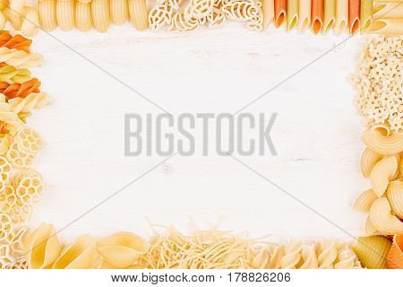 Pasta background decorative frame of assortment different kinds italian macaroni. Mock up restaurant menu.