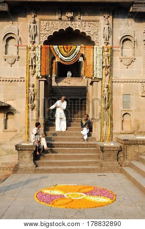 People Speaking In Front Of The Entrance Gate