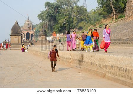 Woman Walking On The Ghat Of Maheshwar On India