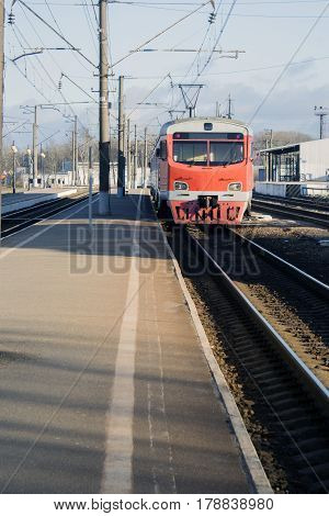 Old passenger train red. Stands on the platform