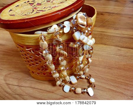 Beads made of natural stone in a casket from birch bark. Closeup. Ural gems. Ural, Russia