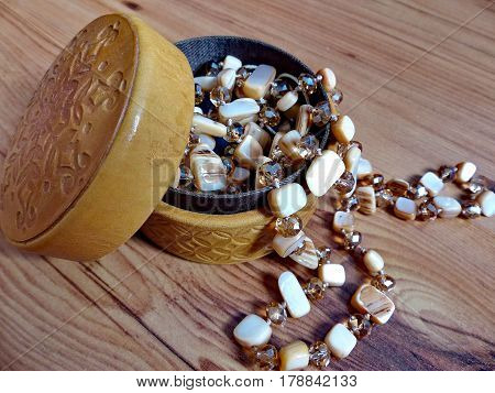 Beads made of natural stone in a casket from birch bark. Closeup. Ural gems. Ural, Russia