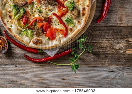 Delicious big vegan pizza with broccoli, greens and mushrooms, additional textspace