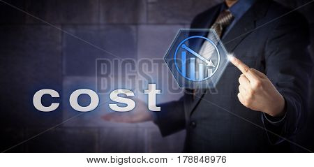 Blue chip comptroller is activating Cost Reduction by touching a virtual push button displaying a downward trend arrow. Business concept for cost reduction controlling and financial forecasting.