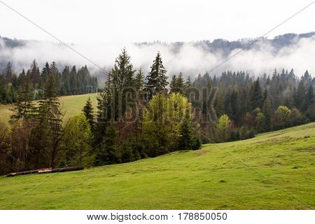 rural mountain landscape in a misty spring morning