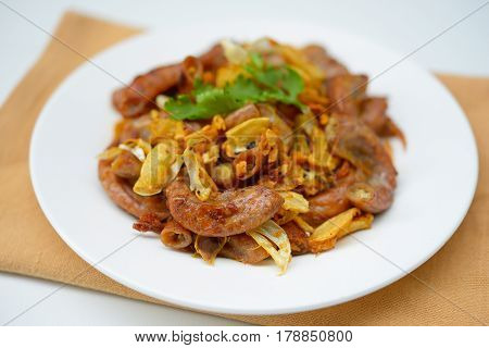 Pork chitterlings, fried garlic, pepper on the plate