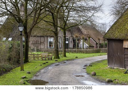 Street with historic farms and barns in Orvelte in the Netherlands