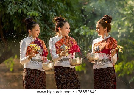 Thai girls splashing water during festival Songkran festival