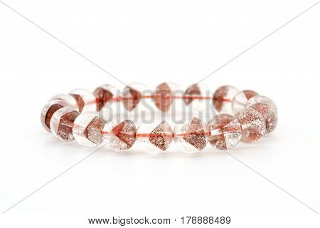 Natural rare Pyramid - shaped mineral inside crystal Quartz beads in bracelet on white background
