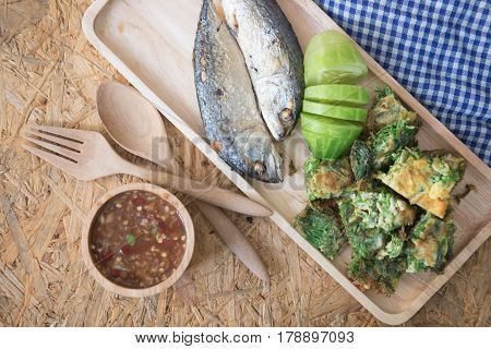 Spicy shrimp paste dip served with fried mackerels sliced cucumber and fried acacia pennata omelet