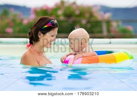Mother And Baby In Swimming Pool