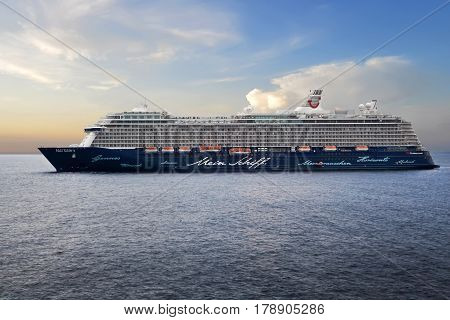 MONTE CARLO, MONACO - OCTOBER 07, 2014: Cruise ship Menie Schiff 3 owned by TUI Cruises, standing still in the open sea next to the port of Monte Carlo