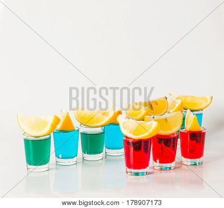 Glasses With Blue, Green And Red Kamikaze, Glamorous Drinks, Mixed Drink Poured Into Shot Glasses