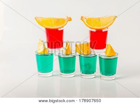 Glasses With Green And Red Kamikaze, Glamorous Drinks, Mixed Drink Poured Into Shot Glasses