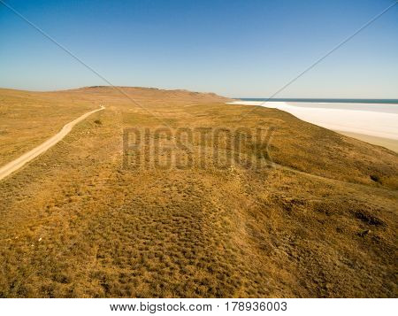 Aerial shot of Koyashskoe pink salt lake firth in Crimea