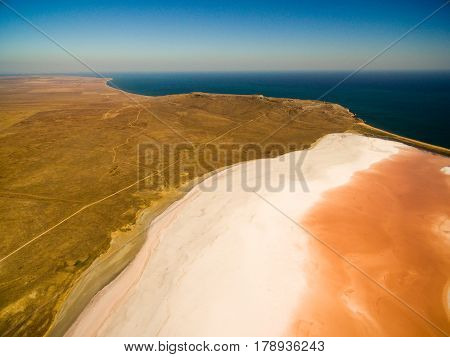 Aerial shot of Koyashskoe pink salt lake firth in Crimea