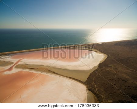 Aerial shot of Koyashskoe pink salt lake firth in Crimea
