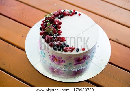 Fresh berries on the tart cake from above. Selective focus on the tart